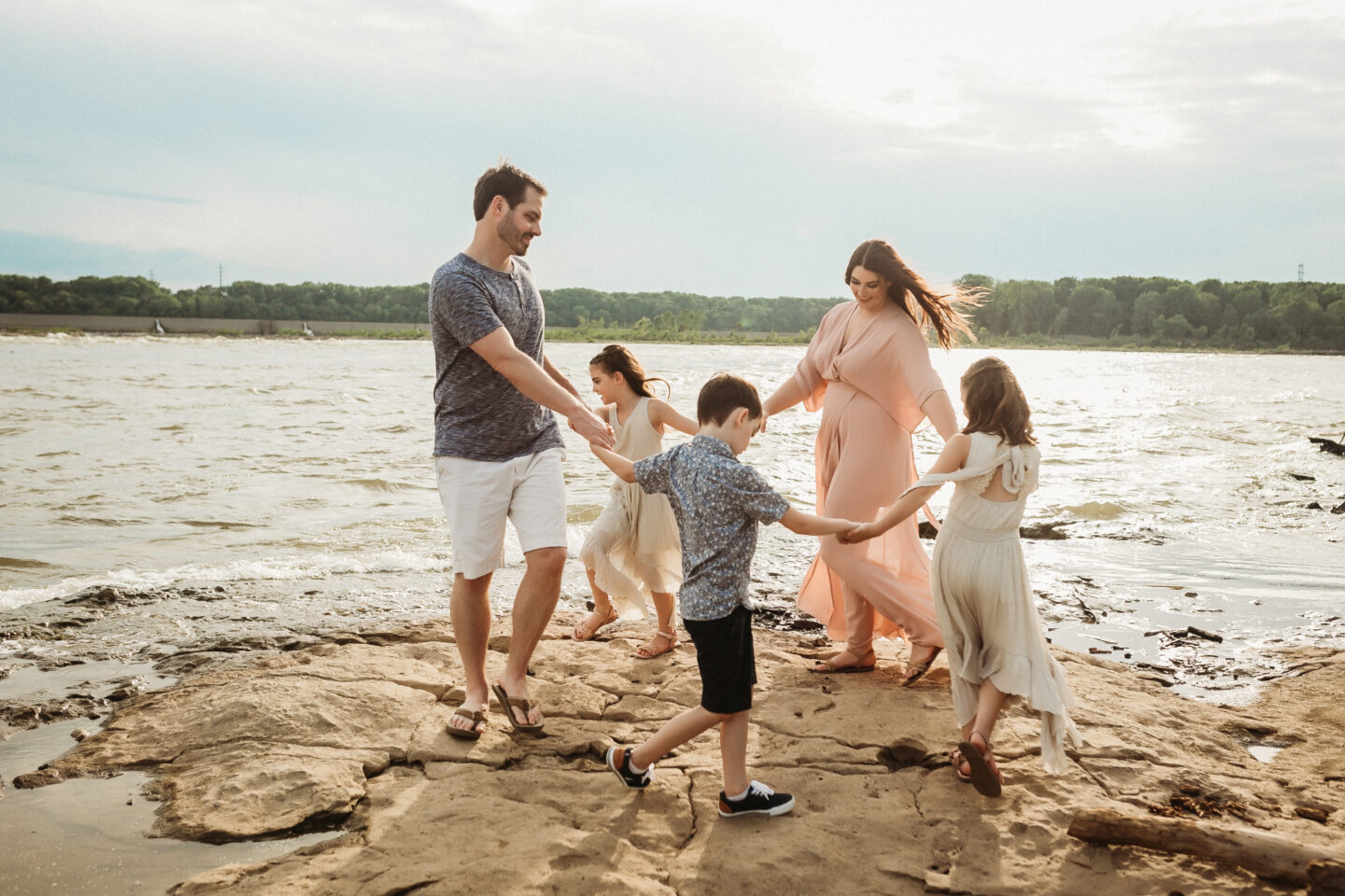 Krysta Manning with her husband and triplets at Falls of the Ohio State Park.